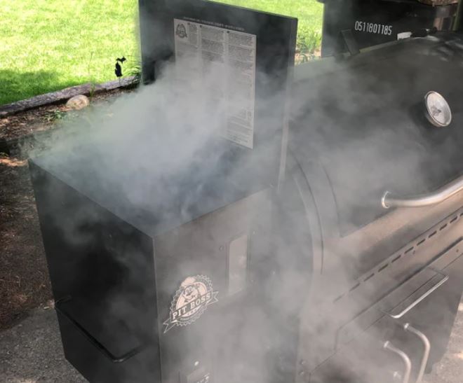 Dense smoke out of hopper of Pit Boss pellet grill due to burnback